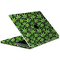 Laptop skin with green cannabis leaf pattern on a black background